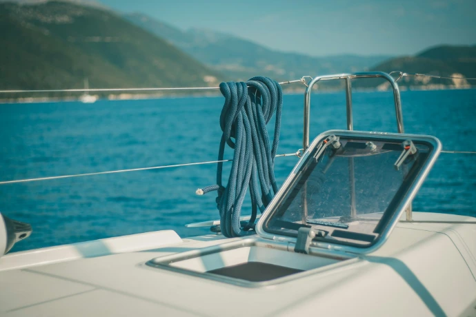 white boat on sea during daytime